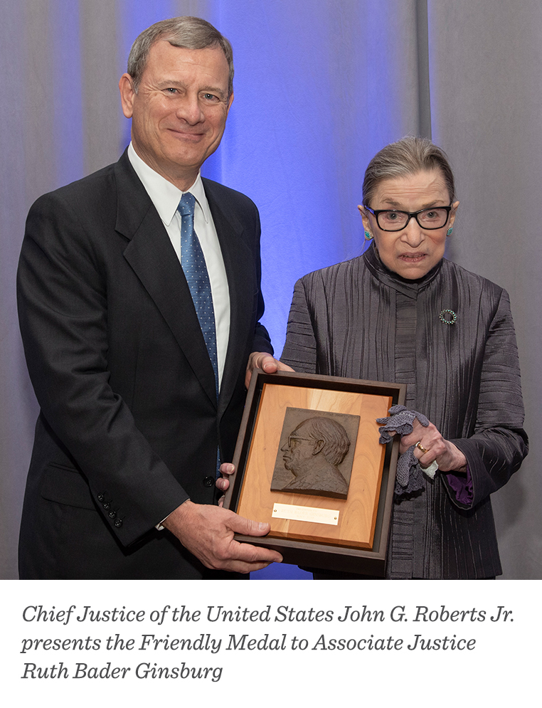 Chief Justice of the United States John G. Roberts Jr. presents the Friendly Medal to Associate Justice Ruth Bader Ginsberg. 